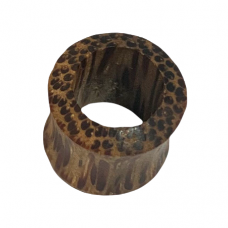 Coconut wood piercing tunnel.