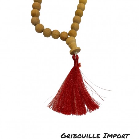Tibetan sandalwood mala necklace with red tassel.